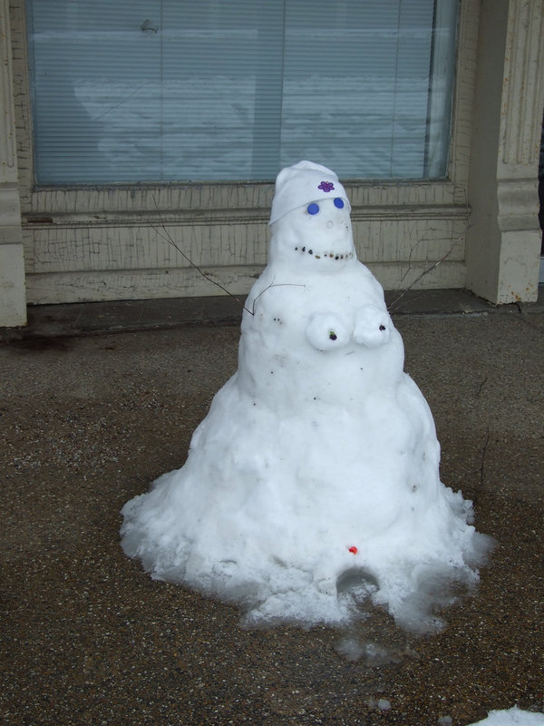 Image: SnowWoman — She was found melting in front of the Uptown Cafe. Do you think she looks like Sandy?