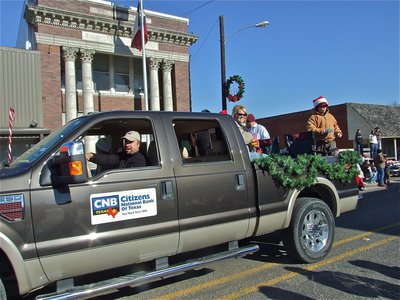 Image: Is Santa real?  — You can bank on it as the Citizens National Bank float passes by Italy City Hall.
