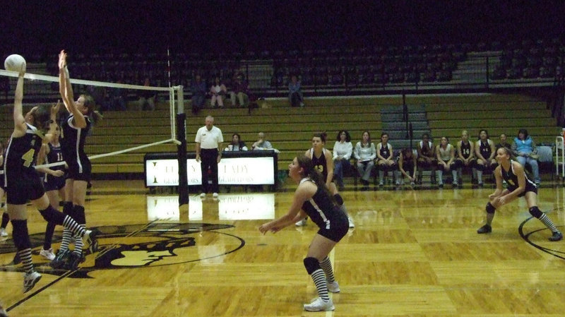 Image: Frontline jumps — Drew Windham and Kaitlyn Rossa cover the net.
