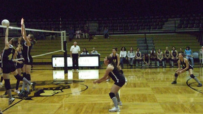 Image: Frontline jumps — Drew Windham and Kaitlyn Rossa cover the net.