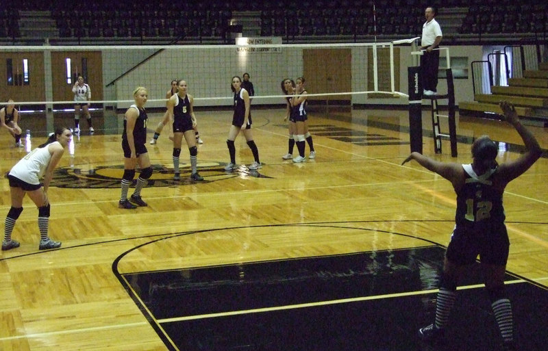 Image: Jaleecia Fleming — Fleming serves. She is a junior this year.