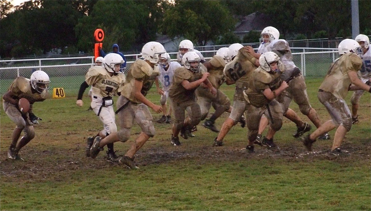 Image: Slick football — Ball control was a problem for the young Gladiator offense.
