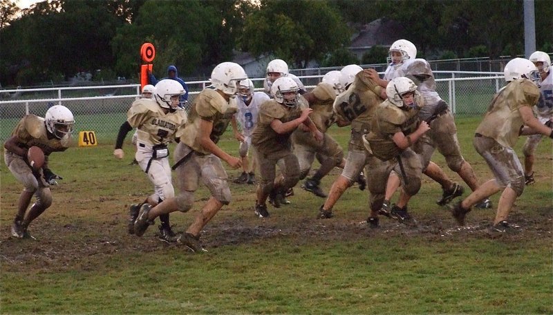 Image: Slick football — Ball control was a problem for the young Gladiator offense.