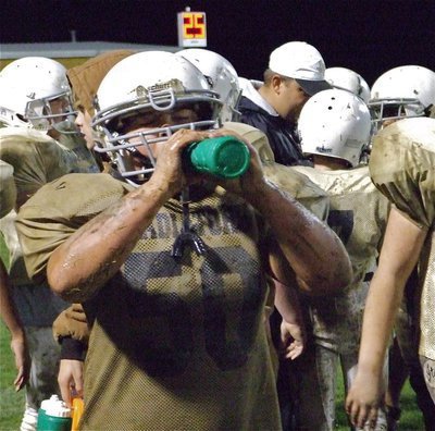 Image: Gulp! Gulp! — Zain Byers tries to get hydrated.