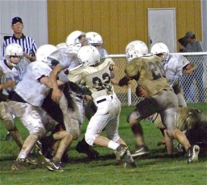 Image: Nice block! — Cody Boyd(32) leads the way for Cody Medrano(28) who tries to score a 2-pont conversion.