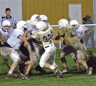 Image: Nice block! — Cody Boyd(32) leads the way for Cody Medrano(28) who tries to score a 2-pont conversion.