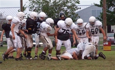 Image: I got it! — Bailey Walton recovers a Dawson fumble.