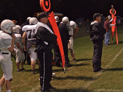 Image: Coaches observe — Coaches Josh Ward and Kyle Holley survey the action on the field.