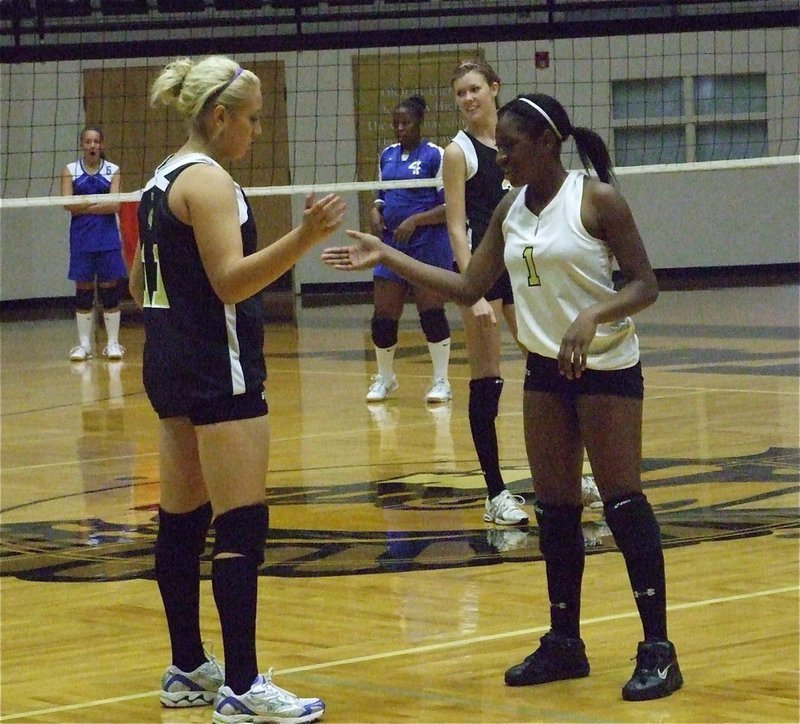 Image: Gimme’ five! — Megan Richards and Jameka Copeland take time to celebrate a good play.
