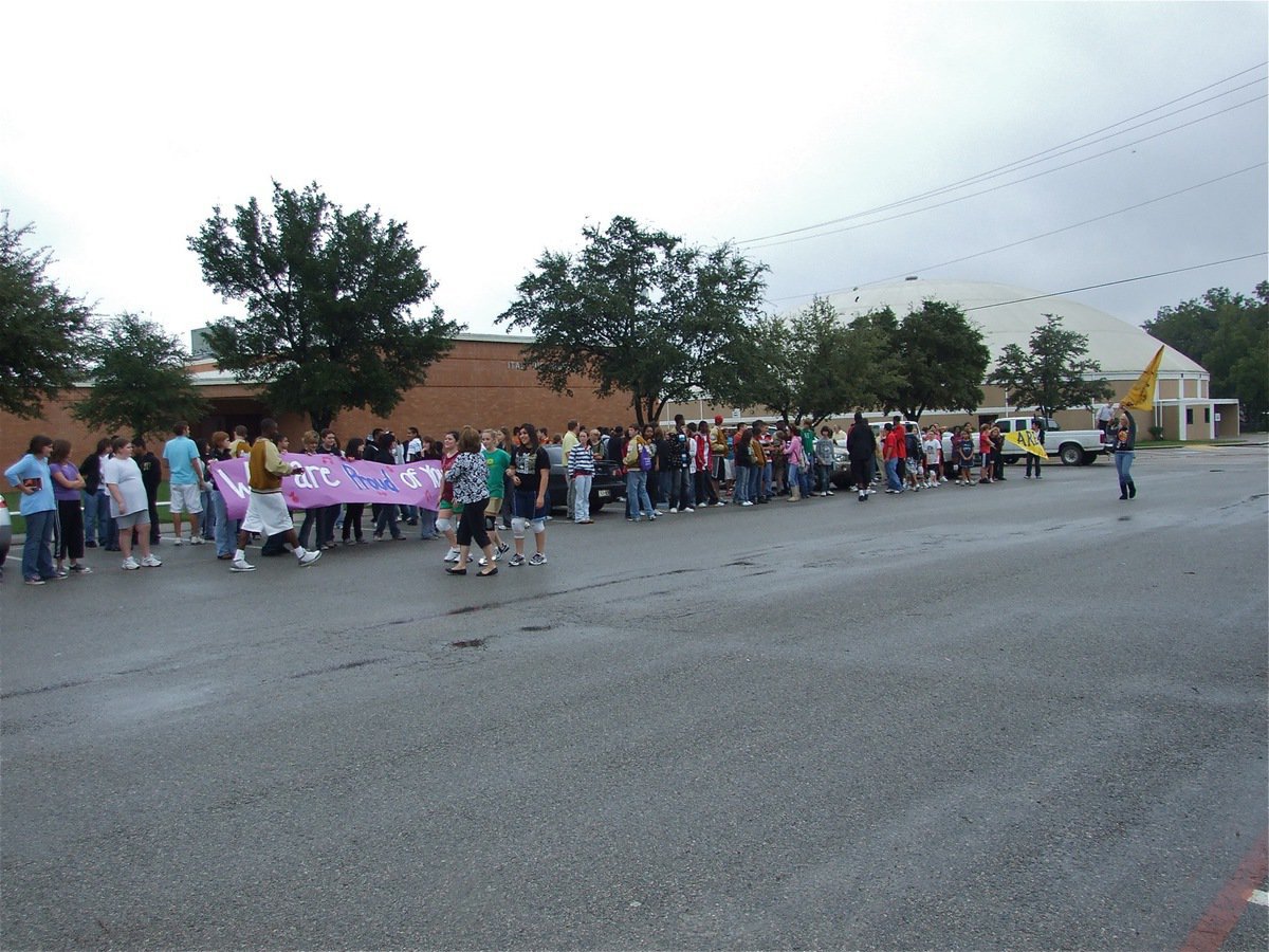 Image: Waiting for the bus — The students, faculty and parents all gathered in the IHS parking lot to congratulate the band and flag corp.