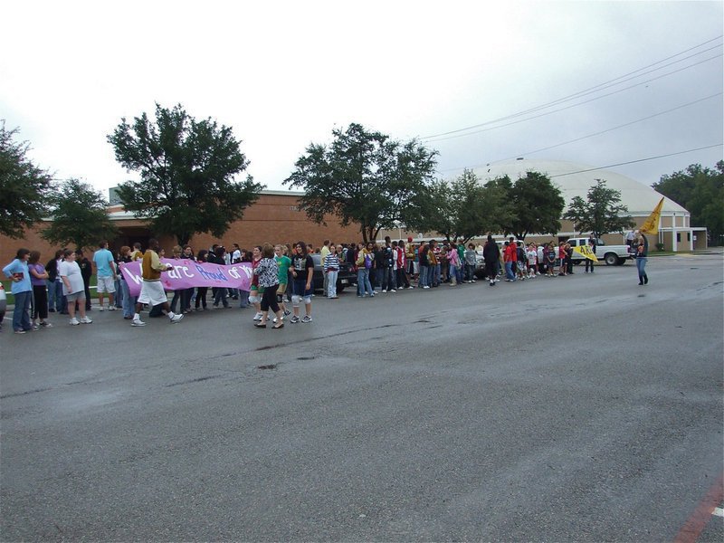Image: Waiting for the bus — The students, faculty and parents all gathered in the IHS parking lot to congratulate the band and flag corp.
