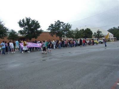 Image: Waiting for the bus — The students, faculty and parents all gathered in the IHS parking lot to congratulate the band and flag corp.