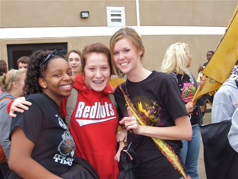 Image: Proud band and members — Fleming, Bumpus and Rossa hug for the camera.