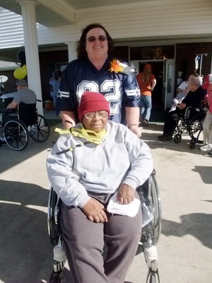 Image: Let’s Eat — Carolyn Powell and resident getting ready for fun.