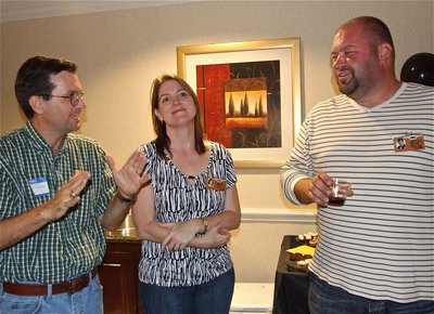 Image: Good company — David Marek with his wife Sandy Brown-Marek try to convince Bryan Gilles he hasn’t changed a bit since high school.