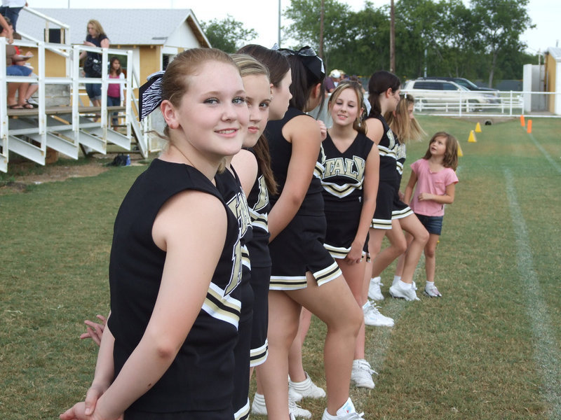 Image: Takes time for a pose — Jesica Wilkins stops cheering for a Kodak moment.