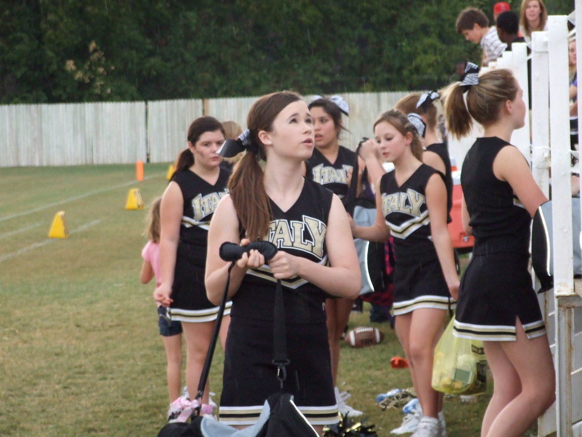 Image: We’re outta here! — Rain drops keep falling on my pom-poms.