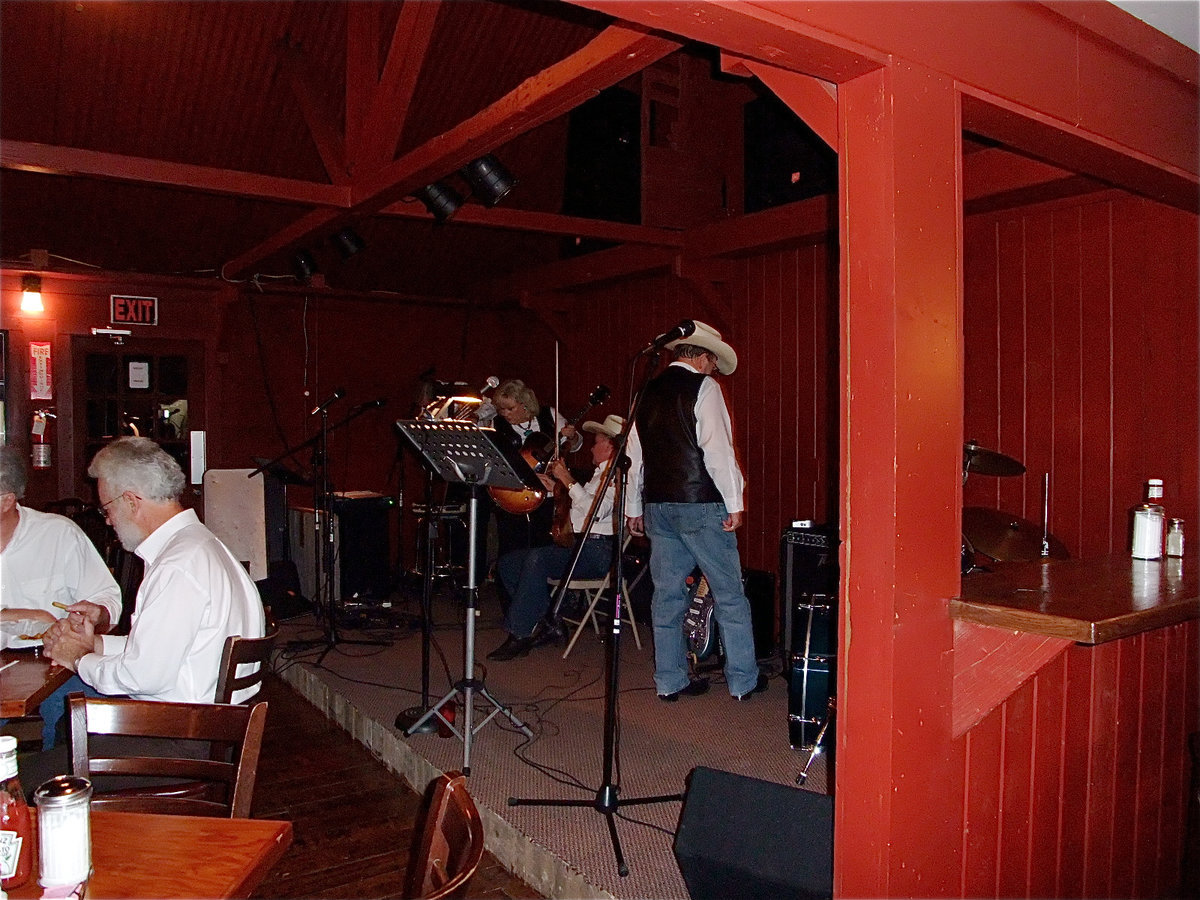 Image: Final Showdown Tuning Up — The band was tuning up for their performance.