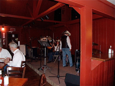 Image: Final Showdown Tuning Up — The band was tuning up for their performance.