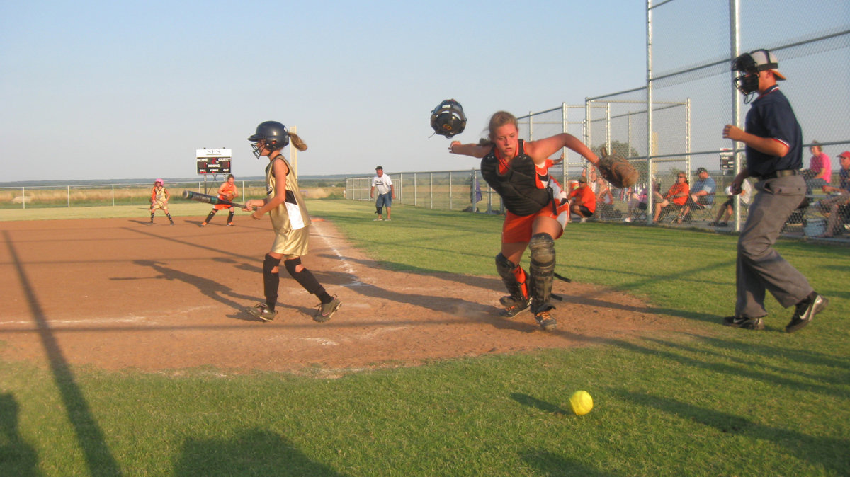 Image: Run Britney, Run! — Britney Chambers takes a called 3rd strike but the ball gets away from the opposing team’s catcher. Britney soon runs toward 1st where she is safe and helps Italy to an eventual 18-17.