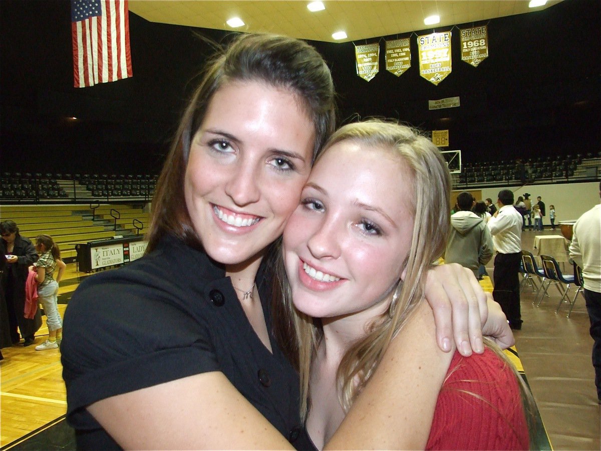 Image: Megann &amp; Jaclynn — Megann Lewis gives her baby sister, Jaclynn, a hug after the Christmas Concert.