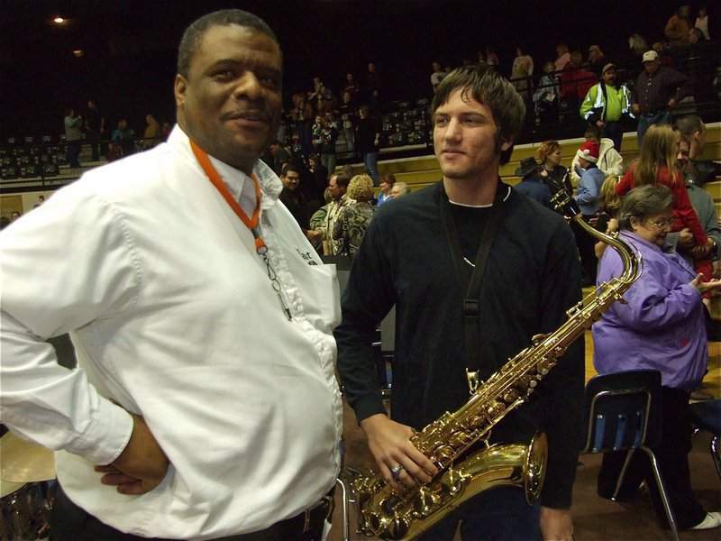 Image: Billy &amp; Ronald — Billy Burkhalter, a former Italy Band member himself, talks shop with senior Ronald Helms.