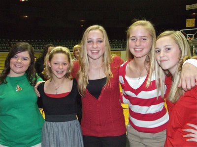 Image: 7th Graders Rock  — Bailey DeBorde, Bailey Eubank, Jaclynn Lewis, Madison Washington and Kelsey Nelson are proud of their 7th grade class’s performance during the Christmas Concert.