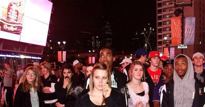 Image: Not in Italy anymore — Gladiators’ players, cheerleaders, coaches and fans watch the larger than life screen hanging on the American Airline Center hanger advertising the Dallas Mavericks’ game against the San Antonio Spurs.