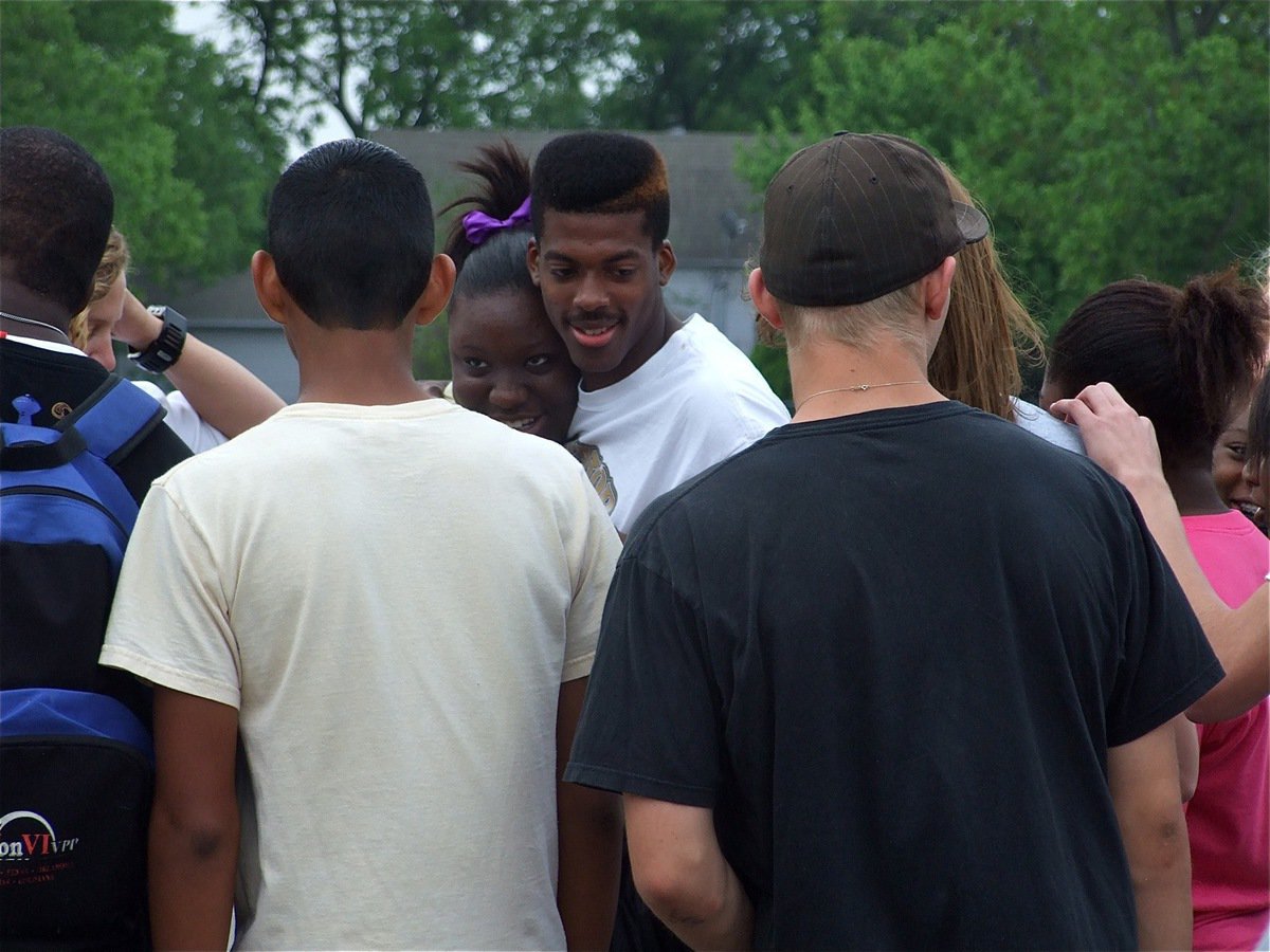 Image: Good luck, Booney! — Jimesha Reed makes her way to the center of the circle to give John Isaac a good luck hug.