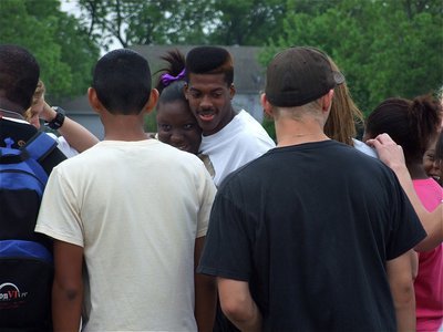 Image: Good luck, Booney! — Jimesha Reed makes her way to the center of the circle to give John Isaac a good luck hug.