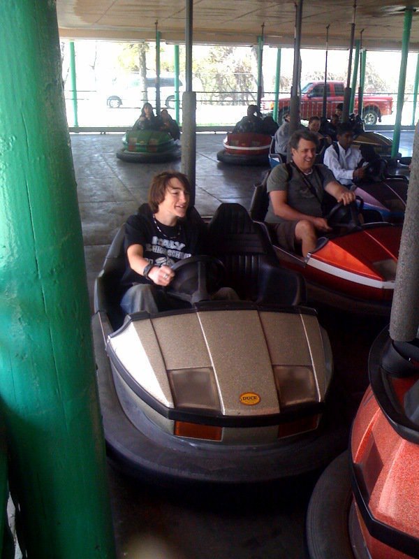 Image: Beep! Beep! — 7th Grade band member Jacob Witte resorts to trying another kind of horn after going bumper-to-bumper with other carnival goers at Sandy Lake.