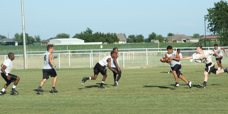 Image: Kyle stretches out — Kyle Wilkins stops the play.