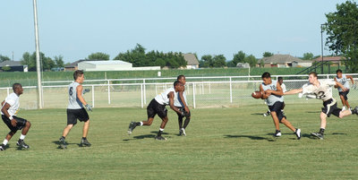 Image: Kyle stretches out — Kyle Wilkins stops the play.