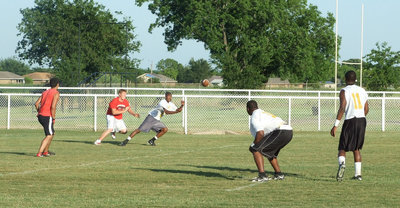 Image: Jasenio tries for the TD — Jasenio attempts a pass for 6 in the endzone.