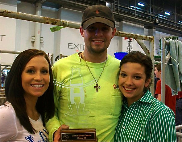 Image: Morgan and friends — Taking a moment to celebrate the 1st in class showing by super swine, Kinsler, are Hillary Gillen, Ty Sparks and Kinsler’s handler, Morgan Cockerham.