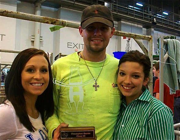 Image: Morgan and friends — Taking a moment to celebrate the 1st in class showing by super swine, Kinsler, are Hillary Gillen, Ty Sparks and Kinsler’s handler, Morgan Cockerham.