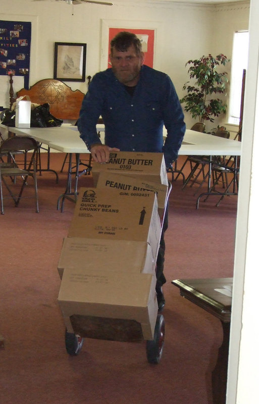 Image: Friend, Bill Youngblood — Bill Youngblood was always helping-anywhere he could. Here, you see Bill loading boxes for the IMA Food Pantry. He was always lending hand. Bill will be missed.