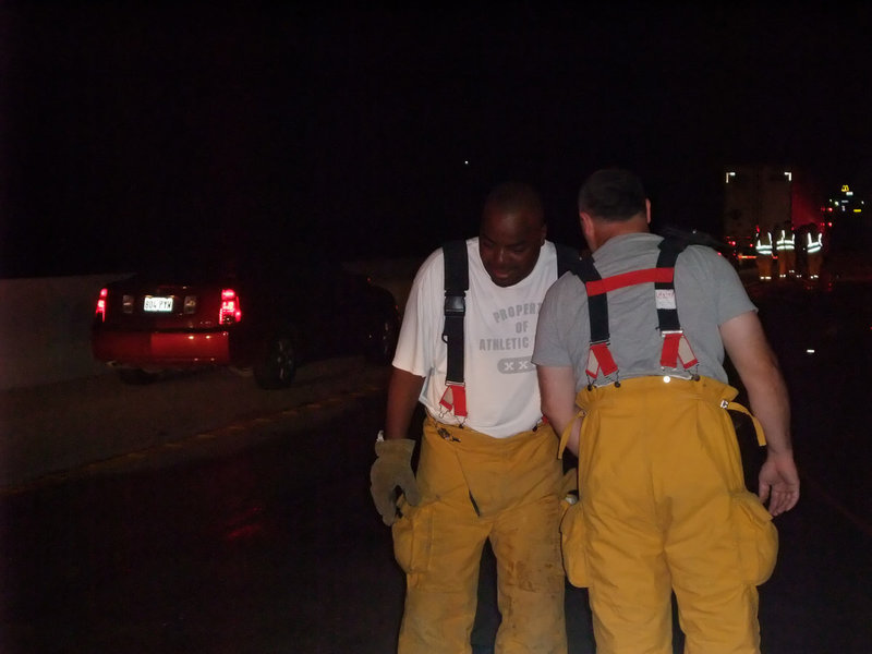 Image: Teammates — Calling a play, just like when they were Gladiators huddling at Willis Field over 20 years ago,