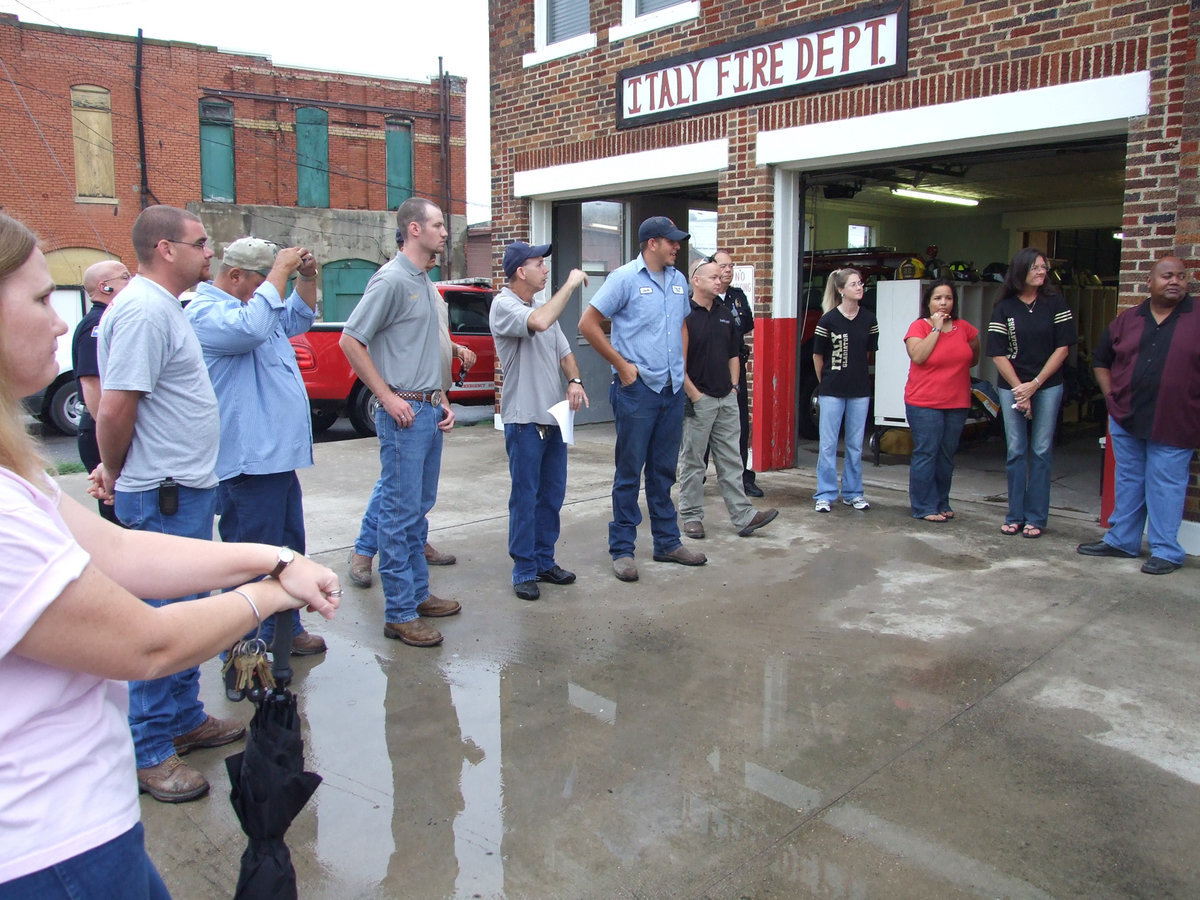 Image: Firefighter’s prayer — All listen as the Firefighter’s Prayer is read by Tommy Sutherland.