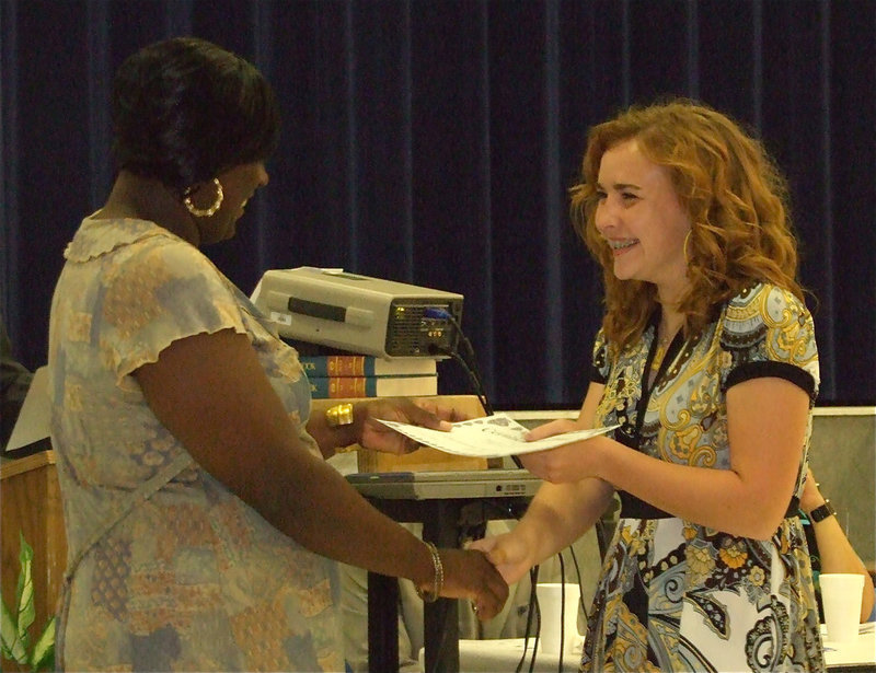 Image: Not strange at all — Tapley Strange was garnished with numerous awards during the banquet and, oddly enough, even without a tennis court in Milford in which to practice, Strange earned 3rd Place in singles at district. Tapley was presented the award by Coach Nikki Hightower.