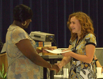 Image: Not strange at all — Tapley Strange was garnished with numerous awards during the banquet and, oddly enough, even without a tennis court in Milford in which to practice, Strange earned 3rd Place in singles at district. Tapley was presented the award by Coach Nikki Hightower.