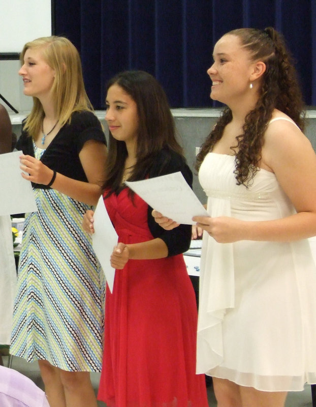 Image: Having a blast! — Laura Harvey, Elizabeth Garza and Genora Armstrong receive applause.