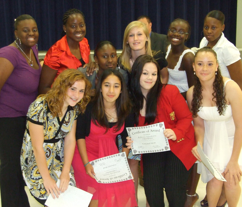 Image: Lady Bulldogs pose — Several Lady Bulldogs strike a pose holding their awards. Back row: Chasity waits, Ashley Ross, Ra’Tara Singleton, Laura Harvey, Jalessa Hightower. Front row: Tapley Strange, Elizabeth Garza, Raborn Sprabary and Genora Armstrong.