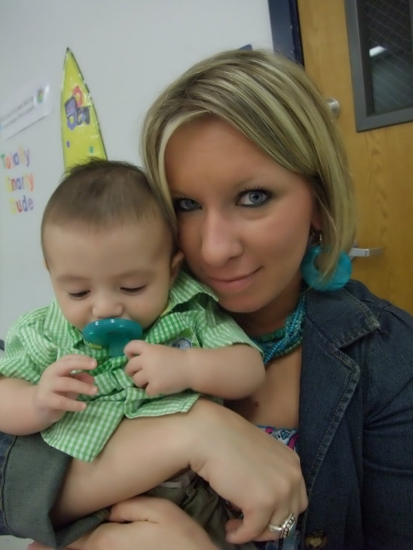 Image: Jaxon and Jami — Jami Wilson keeps Jaxon Fuentez occupied during the ceremonies. Jaxon was later quoted as saying, “Goo Goo, Gha Gha.”