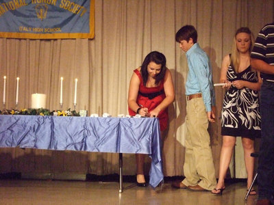 Image: Molly Haight signs the book — The membership book has to be signed before the ceremony is complete.