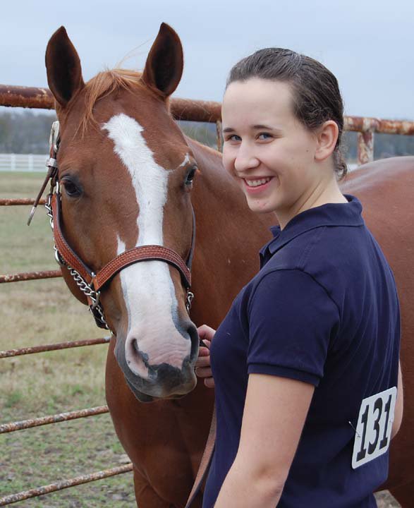 Image: Lisa and Miss Specialty — Lisa Olschewsky, a foreign exchange student from Germany, won the Mares at Halter class with Miss Specialty. Lisa is living with the Hinz Family of Italy during her stay.