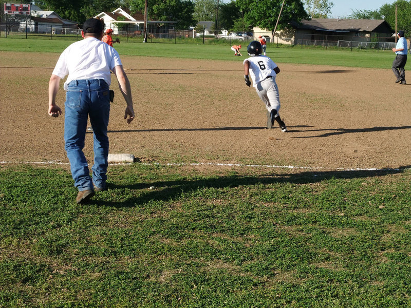 Image: Norwood hits — Ken Norwood, Jr. puts the wood on this shot to the outfield.