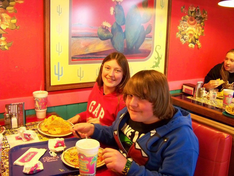 Image: Whitney and Trevor — Whitney Wolaver and Trevor Davis prepare to munch out before the evening’s performance.