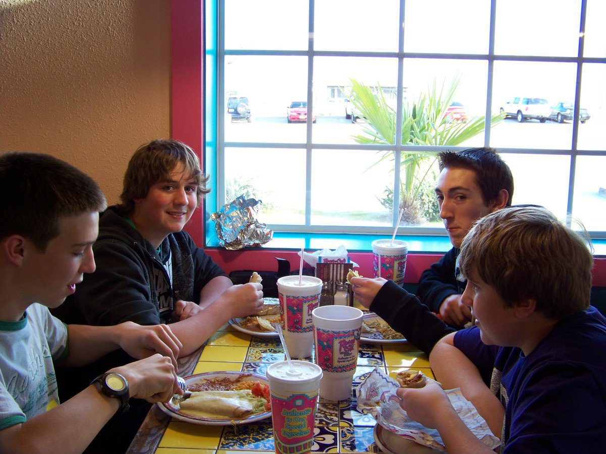 Image: A Dinner Break — Ben Lewis, Joe Mack Pitts, Jacob Witte and Brett Kirton enjoy a break from rehearsal.