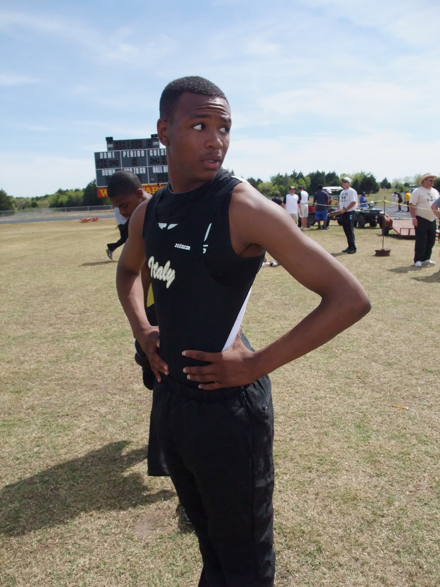 Image: Looking back — Deandre Sephus checks out the competition before the relays.
